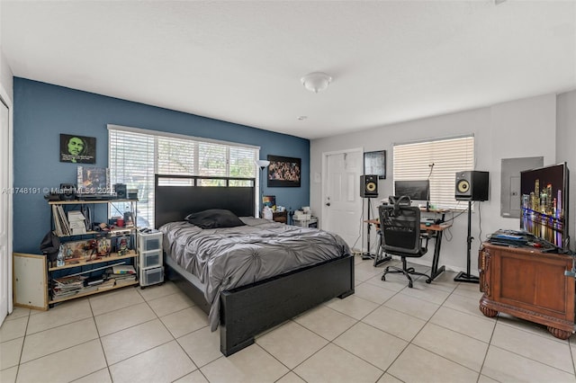 bedroom with light tile patterned floors