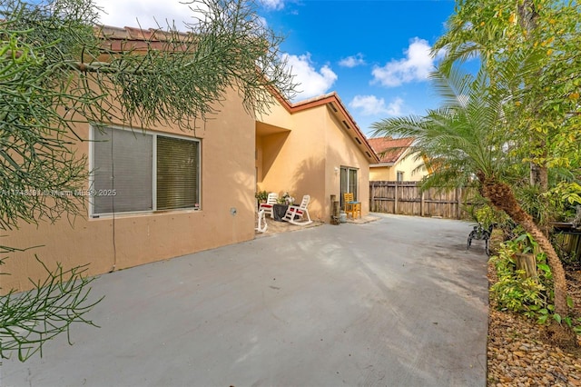 view of patio with fence