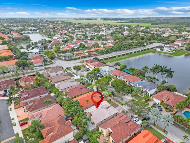 bird's eye view featuring a residential view and a water view