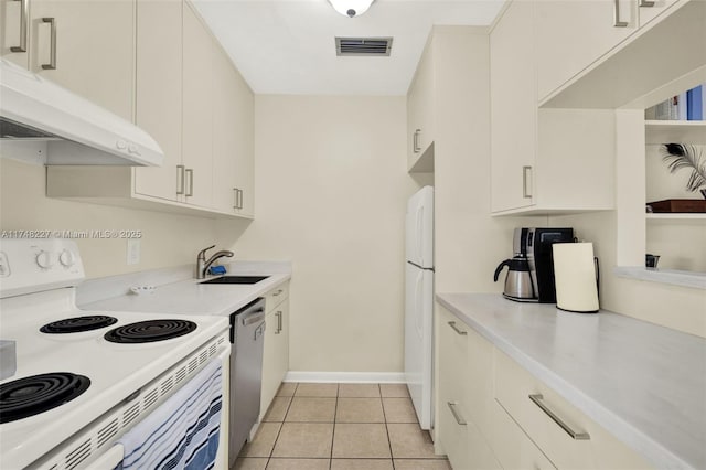 kitchen featuring under cabinet range hood, white appliances, a sink, visible vents, and light countertops