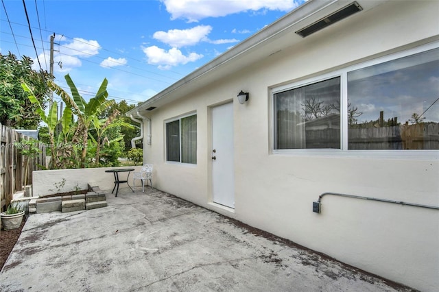 view of patio / terrace featuring fence