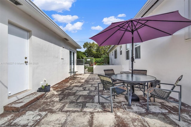 view of patio / terrace with outdoor dining space and fence