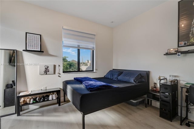 bedroom featuring wood finished floors