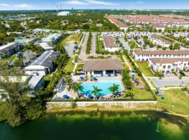 birds eye view of property featuring a water view