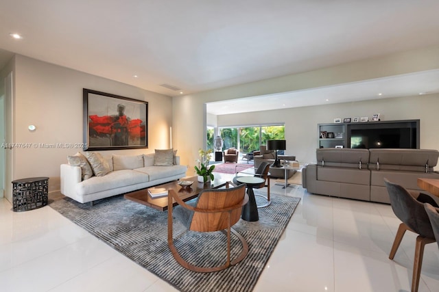 living area featuring recessed lighting, visible vents, and light tile patterned floors