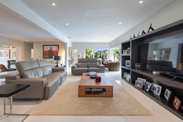 living room with tile patterned flooring and recessed lighting