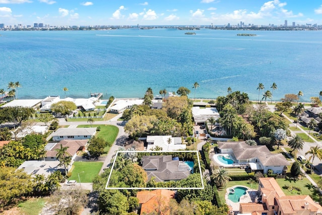 bird's eye view featuring a water view and a city view