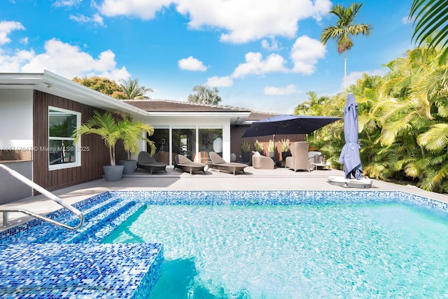 outdoor pool featuring a patio
