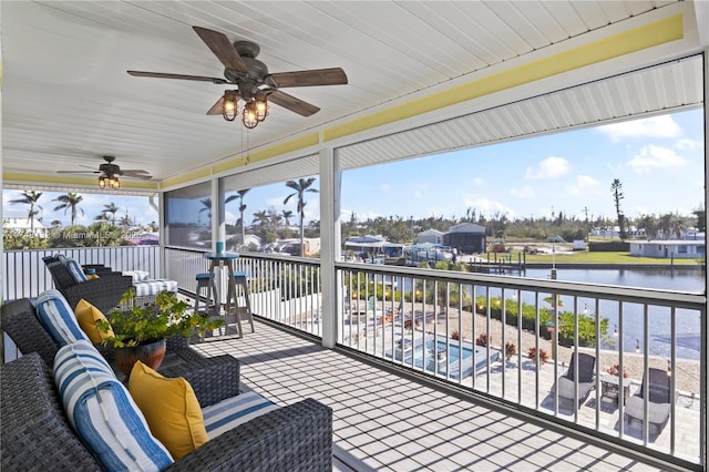 exterior space featuring an outdoor hangout area and a water view