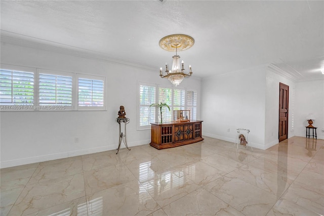 spare room with marble finish floor, baseboards, ornamental molding, and a notable chandelier