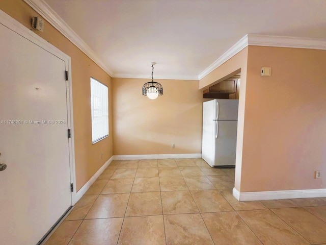 unfurnished dining area featuring light tile patterned floors, baseboards, and crown molding