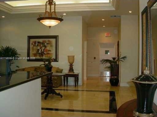 hall featuring recessed lighting, tile patterned floors, and crown molding