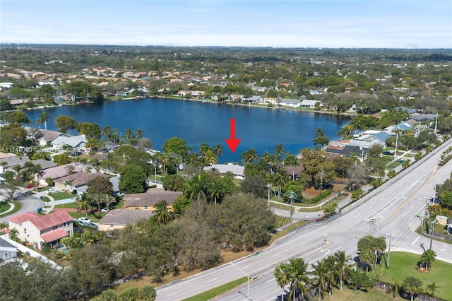 birds eye view of property featuring a residential view and a water view