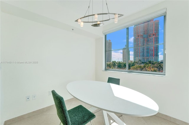 dining space featuring light tile patterned floors and a city view