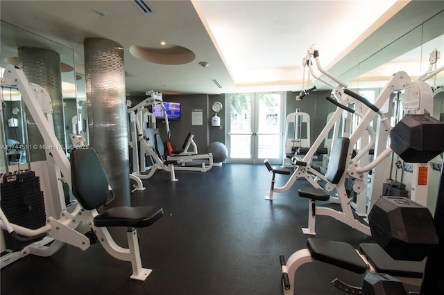 gym featuring visible vents and french doors