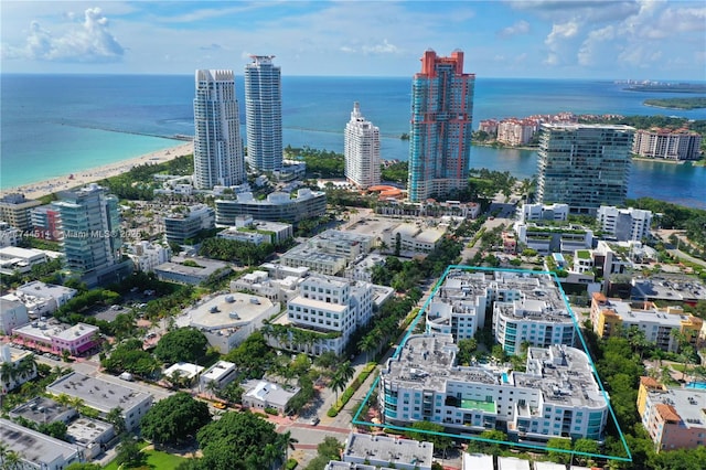 birds eye view of property featuring a view of city and a water view