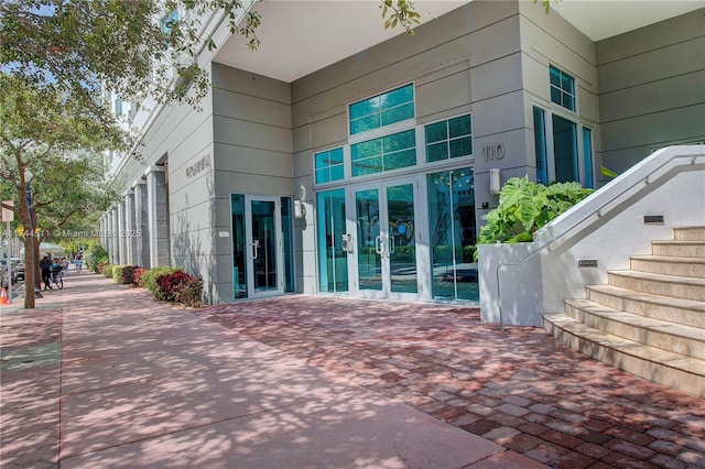 view of exterior entry featuring french doors