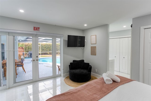 bedroom with baseboards, recessed lighting, french doors, and access to exterior