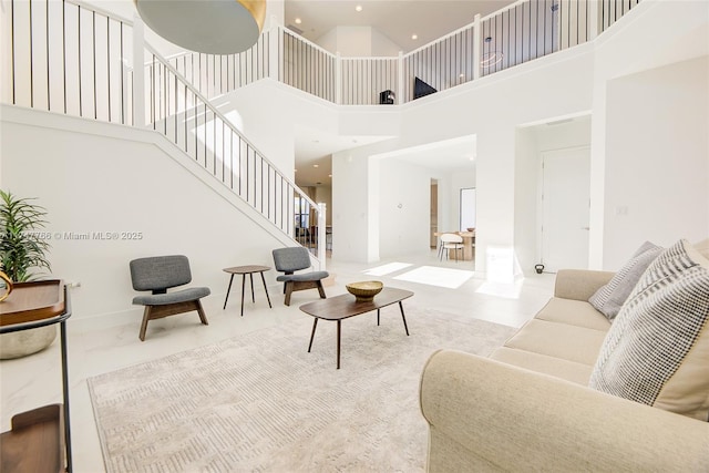 living room with stairs and recessed lighting