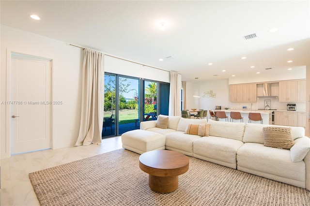 living area featuring a toaster, visible vents, and recessed lighting