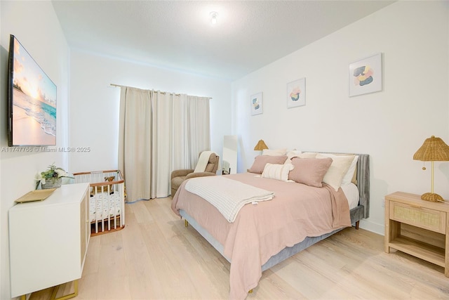 bedroom with light wood-style flooring