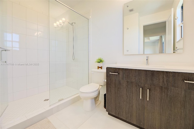 full bath with toilet, tile patterned flooring, tiled shower, and vanity