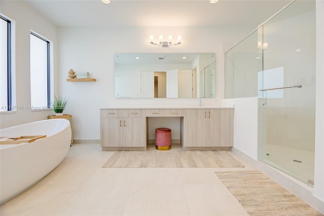 full bathroom with tile patterned flooring, recessed lighting, vanity, a freestanding bath, and a stall shower