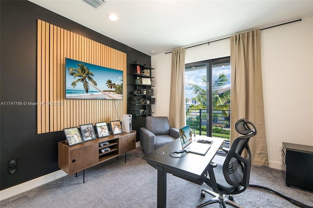 home office with carpet, visible vents, and baseboards