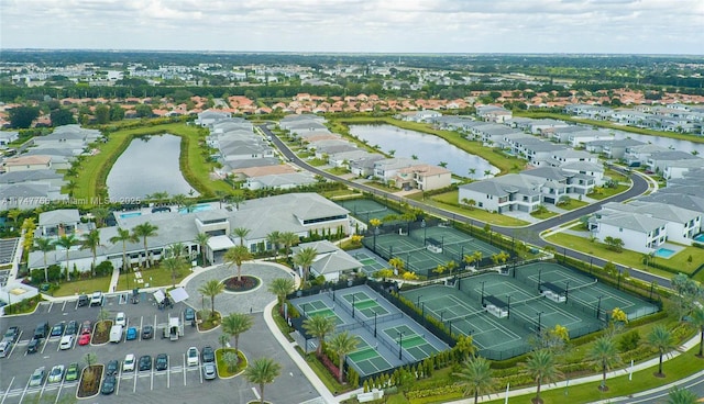 drone / aerial view featuring a water view and a residential view