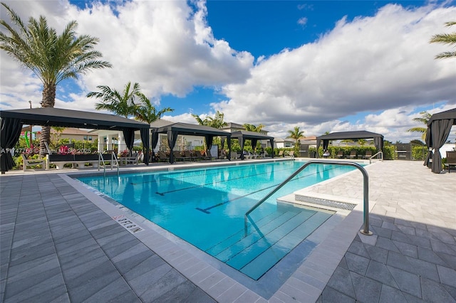 community pool featuring a patio area and a gazebo