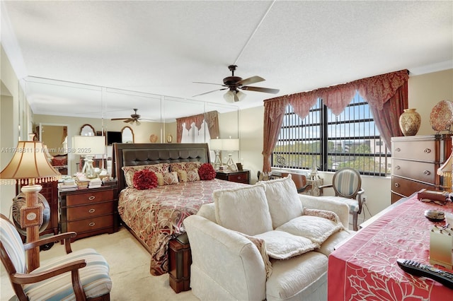 bedroom featuring light carpet, a textured ceiling, and crown molding