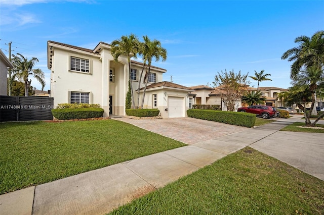 8851 SW 208th Ter, Cutler Bay, FL 33189 - view of front of home with stucco siding, a garage, decorative driveway, and a front yard