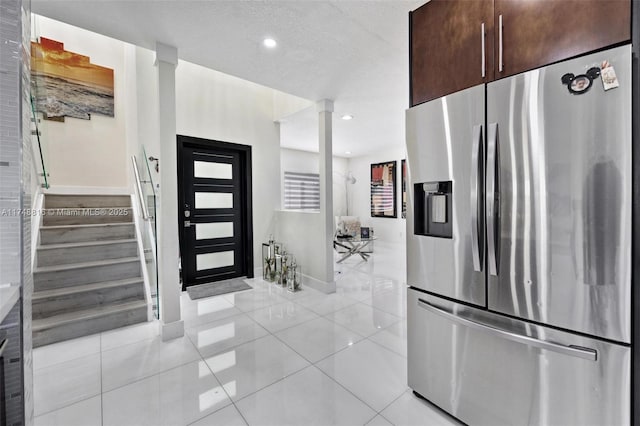 8851 SW 208th Ter, Cutler Bay, FL 33189 - kitchen with recessed lighting, light tile patterned floors, stainless steel fridge with ice dispenser, a textured ceiling, and dark brown cabinetry