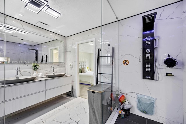 8851 SW 208th Ter, Cutler Bay, FL 33189 - bathroom with a sink, ensuite bath, marble finish floor, and visible vents