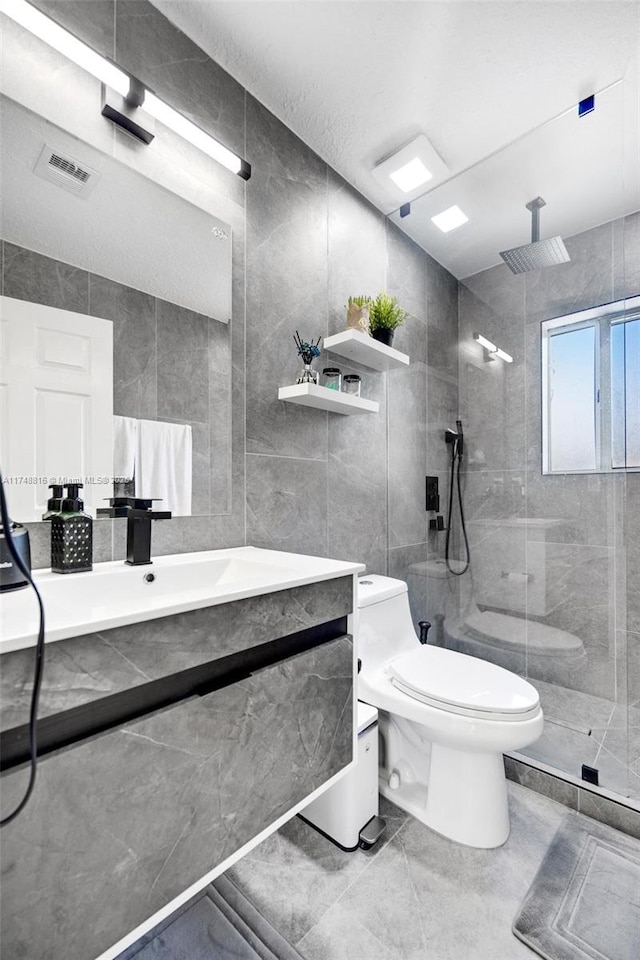 8851 SW 208th Ter, Cutler Bay, FL 33189 - bathroom with vanity, toilet, tile walls, and walk in shower