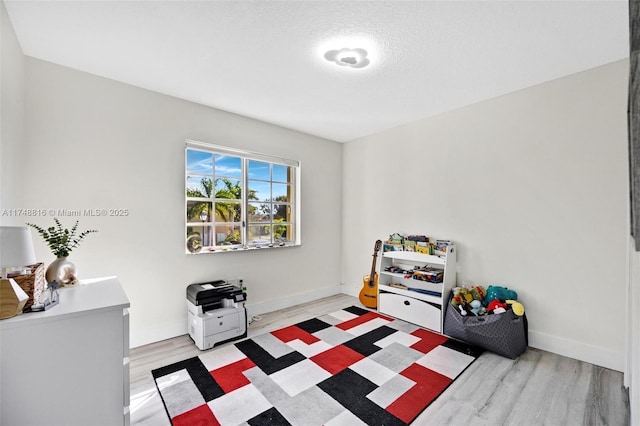 8851 SW 208th Ter, Cutler Bay, FL 33189 - rec room featuring baseboards and light wood-type flooring