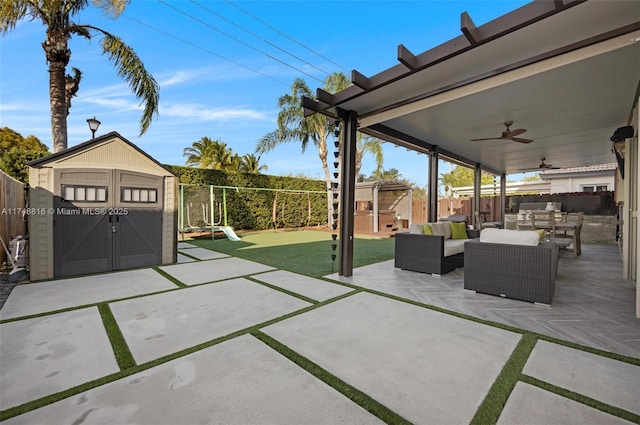 8851 SW 208th Ter, Cutler Bay, FL 33189 - view of patio featuring ceiling fan, an outbuilding, a playground, a fenced backyard, and outdoor lounge area