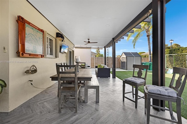 8851 SW 208th Ter, Cutler Bay, FL 33189 - view of patio / terrace featuring a fenced backyard, an outdoor structure, a storage unit, and outdoor dining space