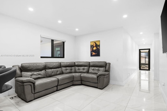 living area with baseboards and recessed lighting