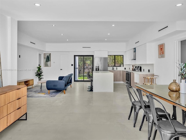 dining area featuring recessed lighting