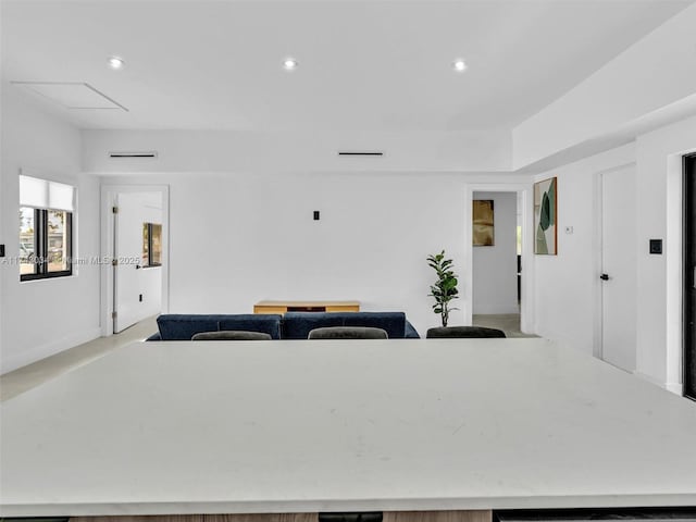 interior space with recessed lighting, open floor plan, and light countertops