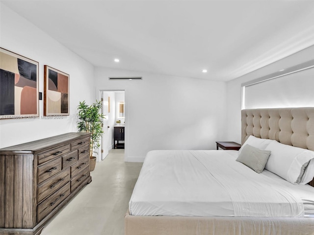 bedroom with recessed lighting, finished concrete flooring, and baseboards