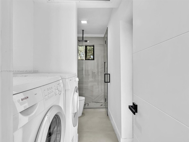 laundry area featuring independent washer and dryer and laundry area