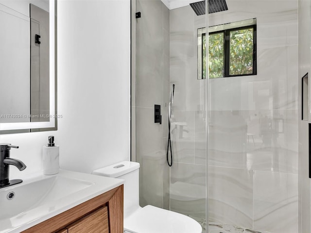 full bathroom with a stall shower, toilet, and vanity