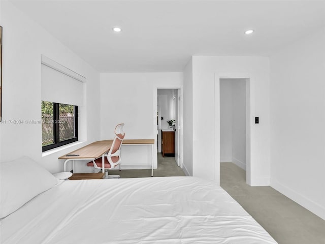 bedroom with recessed lighting and baseboards