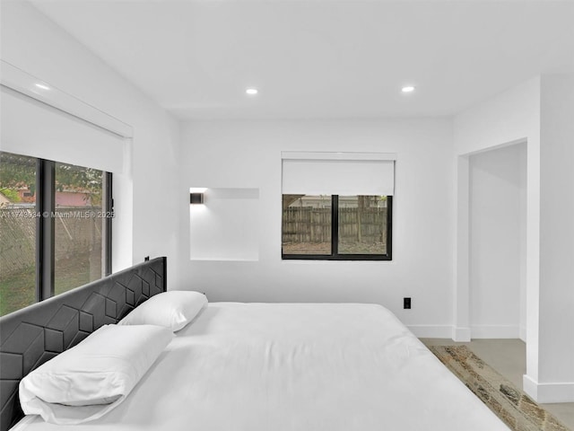 bedroom with recessed lighting and baseboards