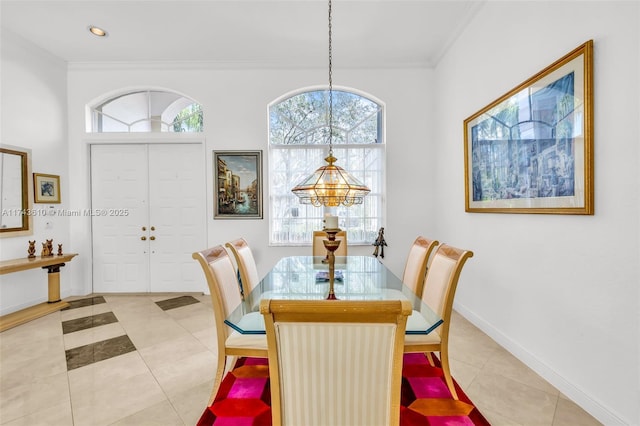 dining room with light tile patterned floors, baseboards, crown molding, and recessed lighting