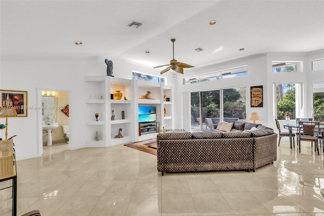 living area featuring ceiling fan, built in shelves, light tile patterned floors, and visible vents