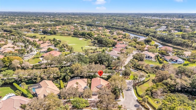 birds eye view of property with a residential view, view of golf course, and a water view