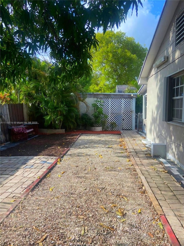 3015 SW 24th Ter, Miami, FL 33145 - fenced backyard with a patio area